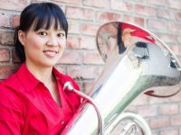 Image of Yi-Ching Chen, Director of Education and Community Engagement with the Ann Arbor Symphony Orchestra
